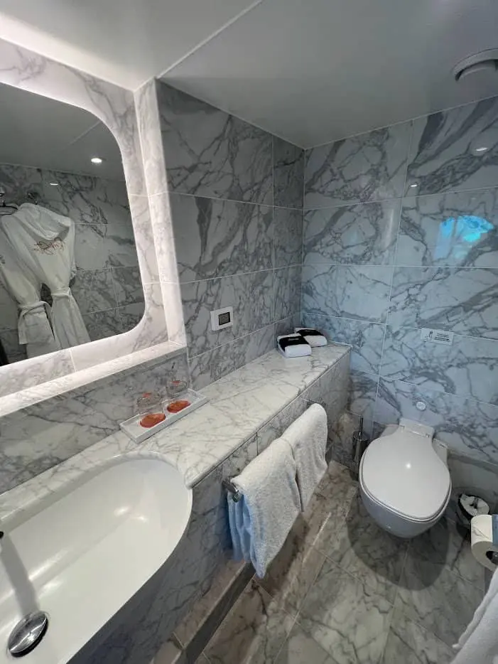 Interior of a Virgin Voyages ship, showcasing modern design